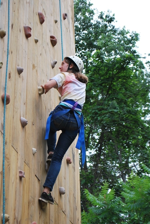 Camper climbing the rockwall.