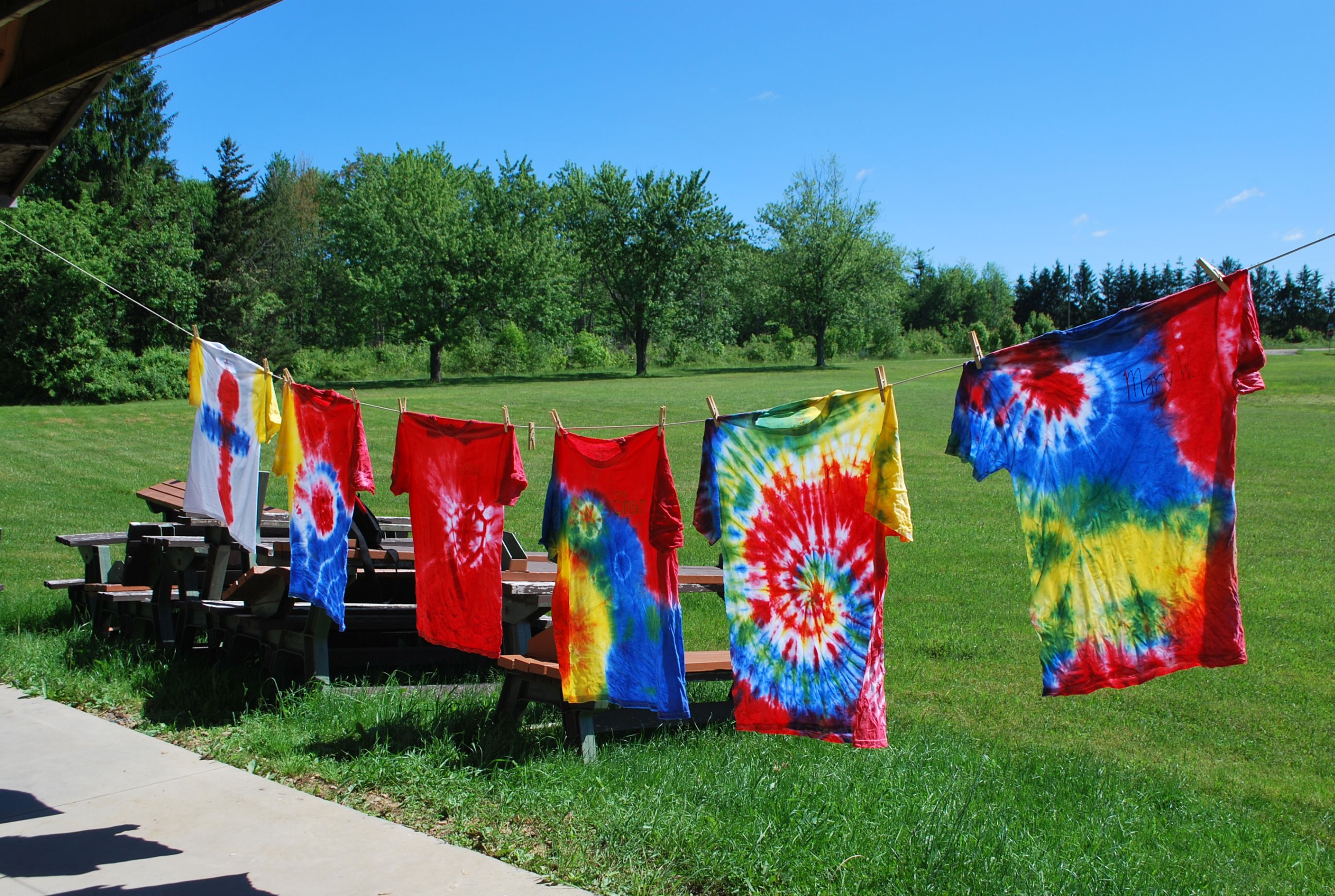 Our exceptional campers sitting on a bench enjoying each others company.